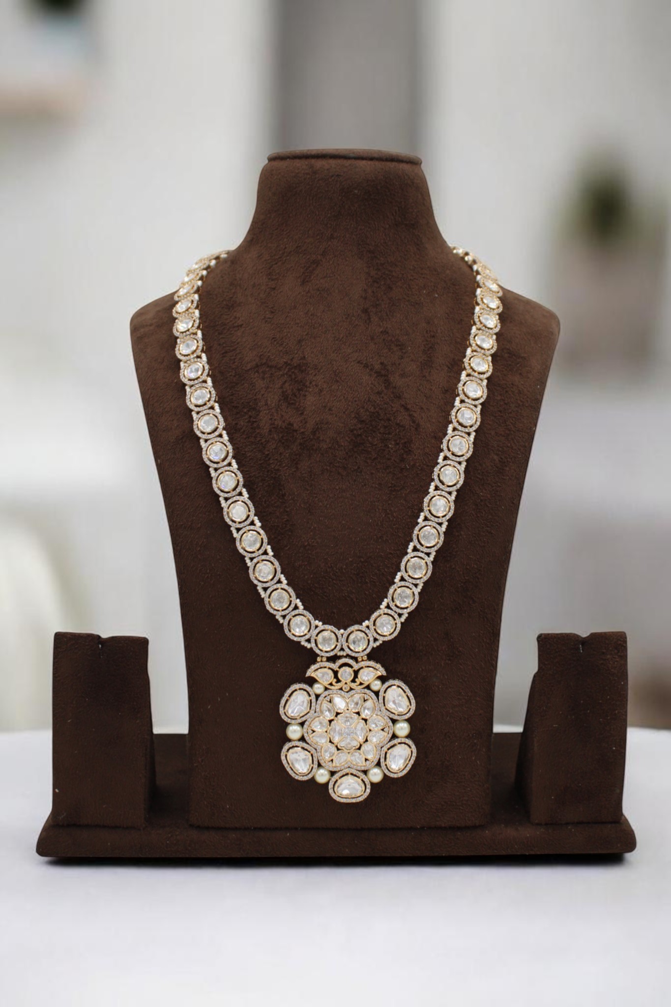 Elegant Gold and Diamond Necklace Display - Image 2
