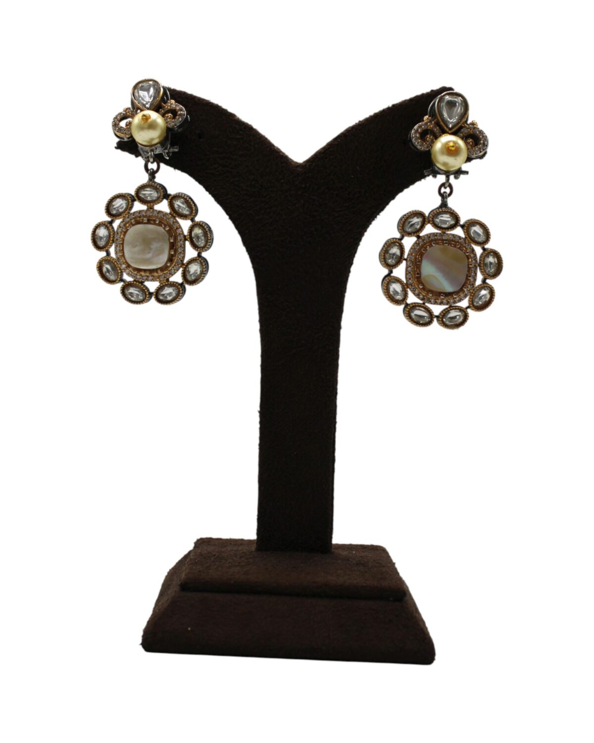 Elegant Vintage Earrings Displayed on a Stand