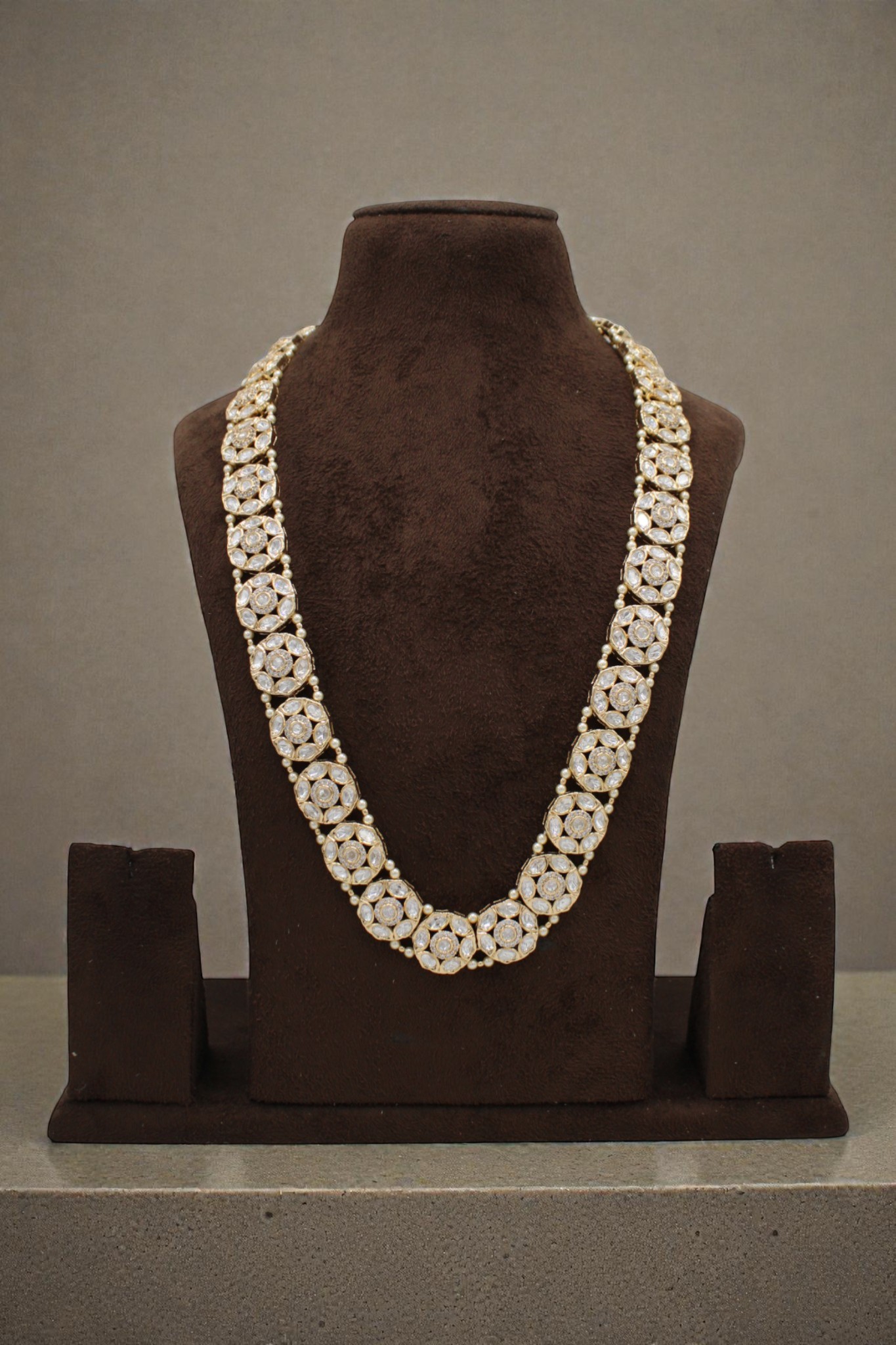 Elegant Gold and Pearl Floral Necklace Displayed on a Bust - Image 3