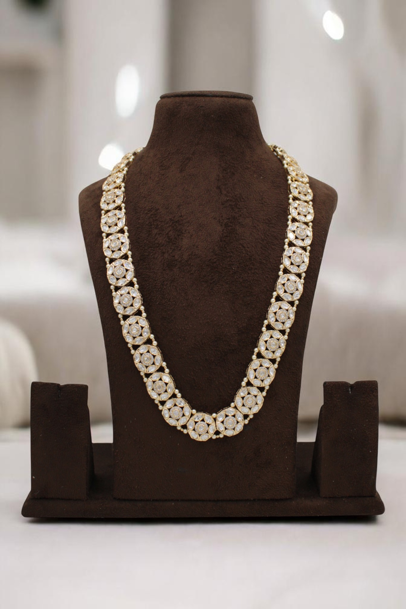 Elegant Gold and Pearl Floral Necklace Displayed on a Bust - Image 2