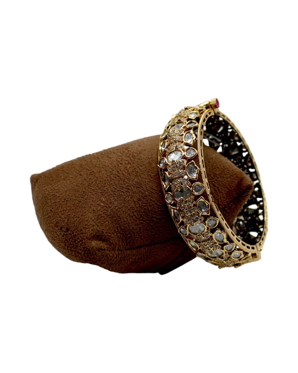 Elegant Gold and Diamond-Studded Bangle on Velvet Display