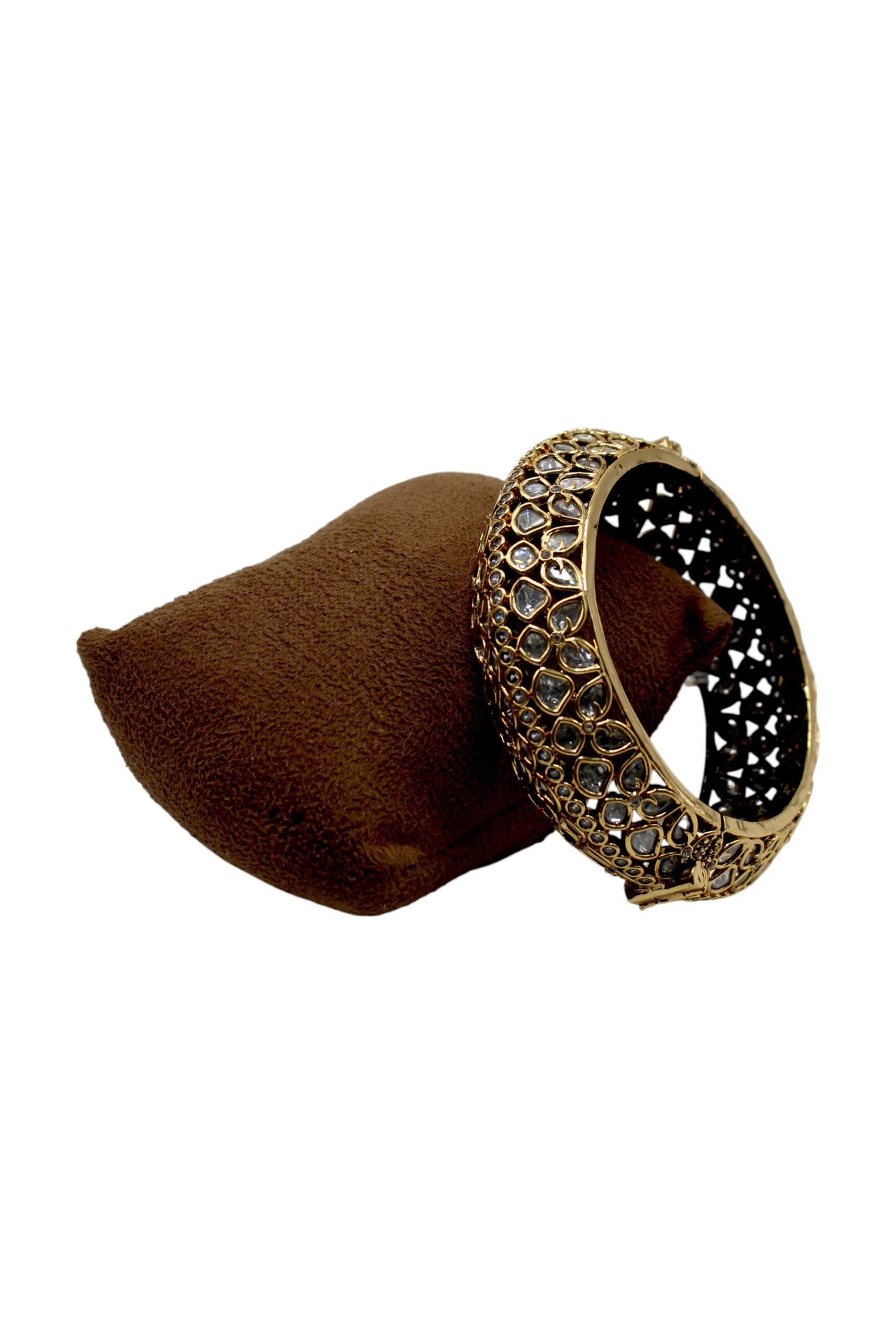 Elegant Gold and Stone-Studded Bangle on Velvet Pouch