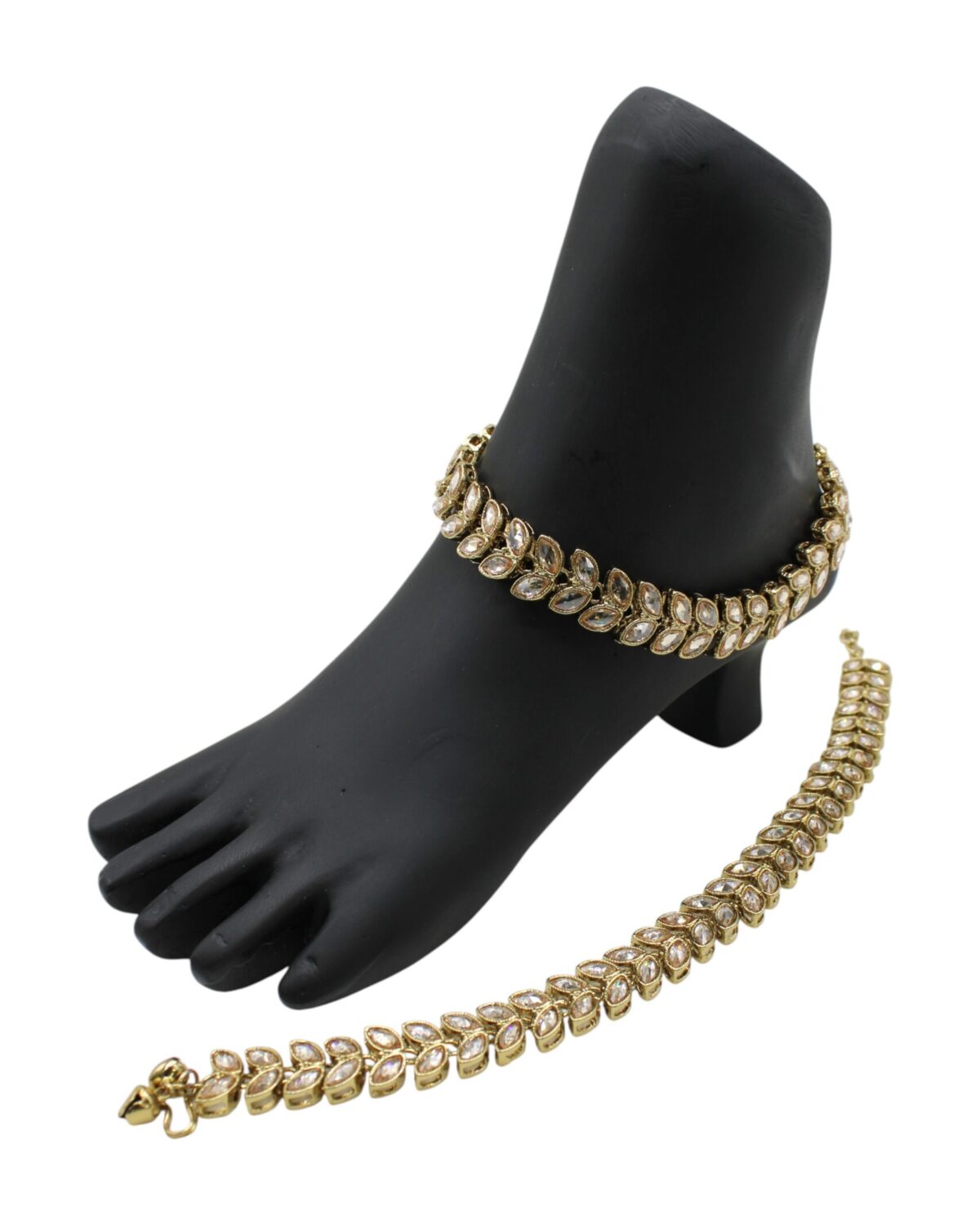 Elegant Gold Anklet and Bracelet Set Displayed on a Black Foot Model