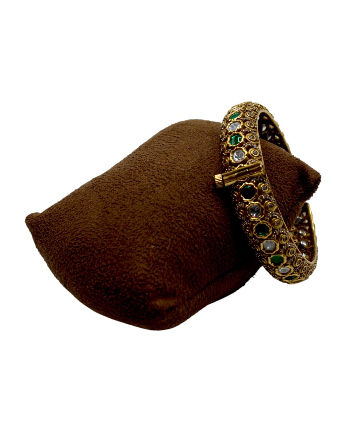 Elegant Gold and Green Stone Bangle on Velvet Cushion