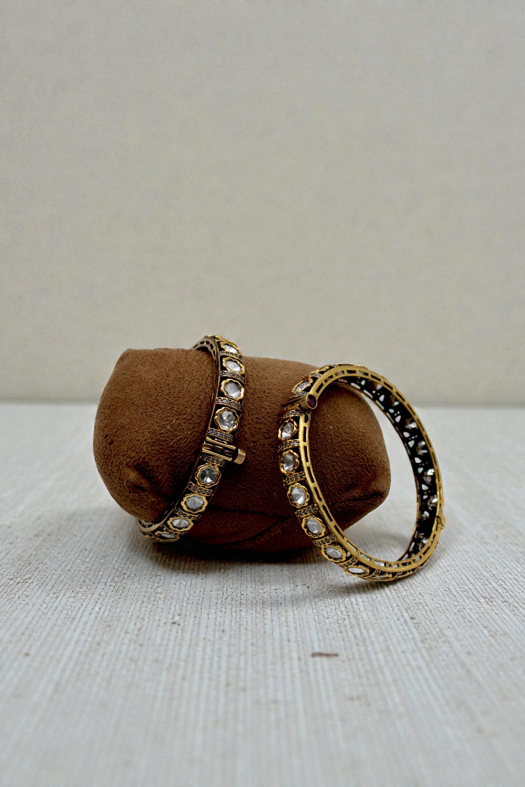 Elegant Gold and Diamond Bangles on Display - Image 2