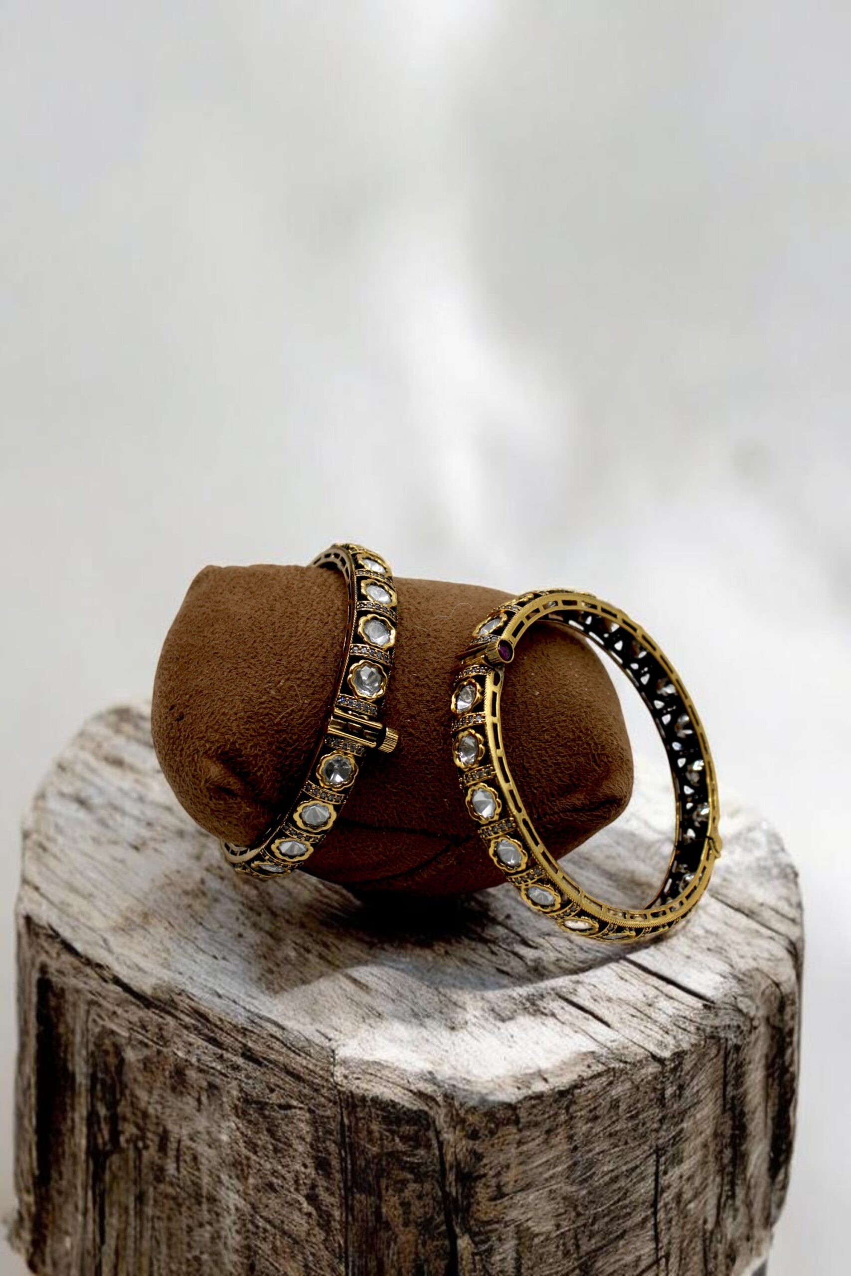 Elegant Gold and Diamond Bangles on Display - Image 3