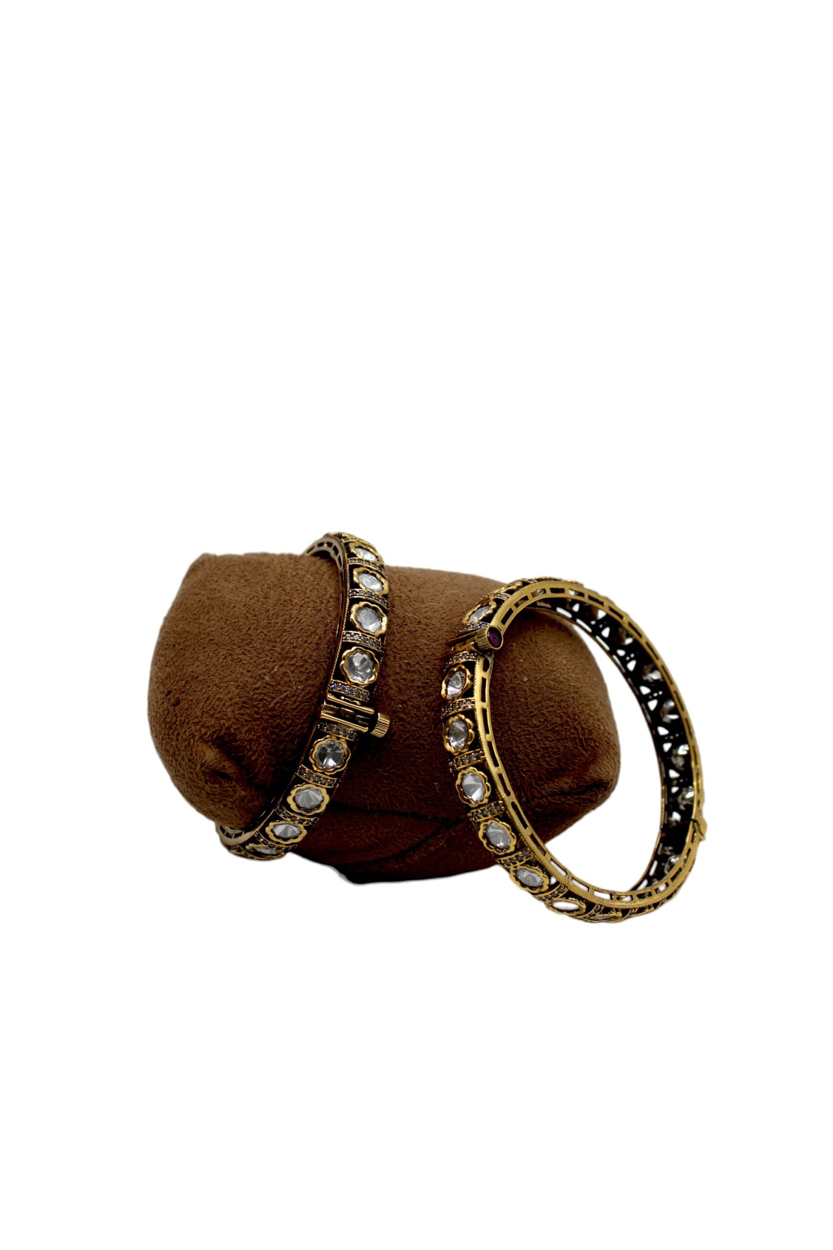 Elegant Gold and Diamond Bangles on Display