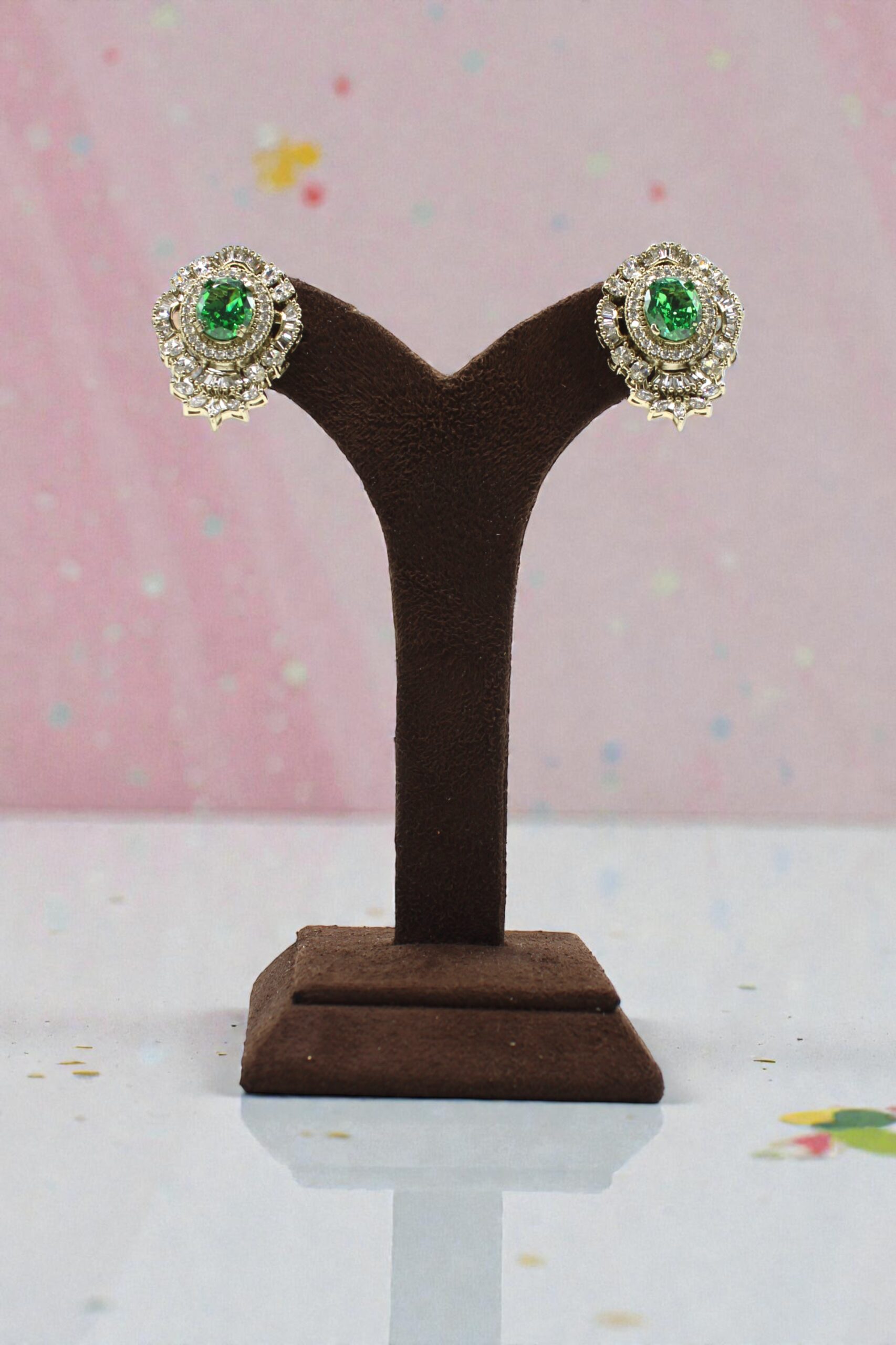 Elegant Green Stone Earrings Displayed on a Stand - Image 2