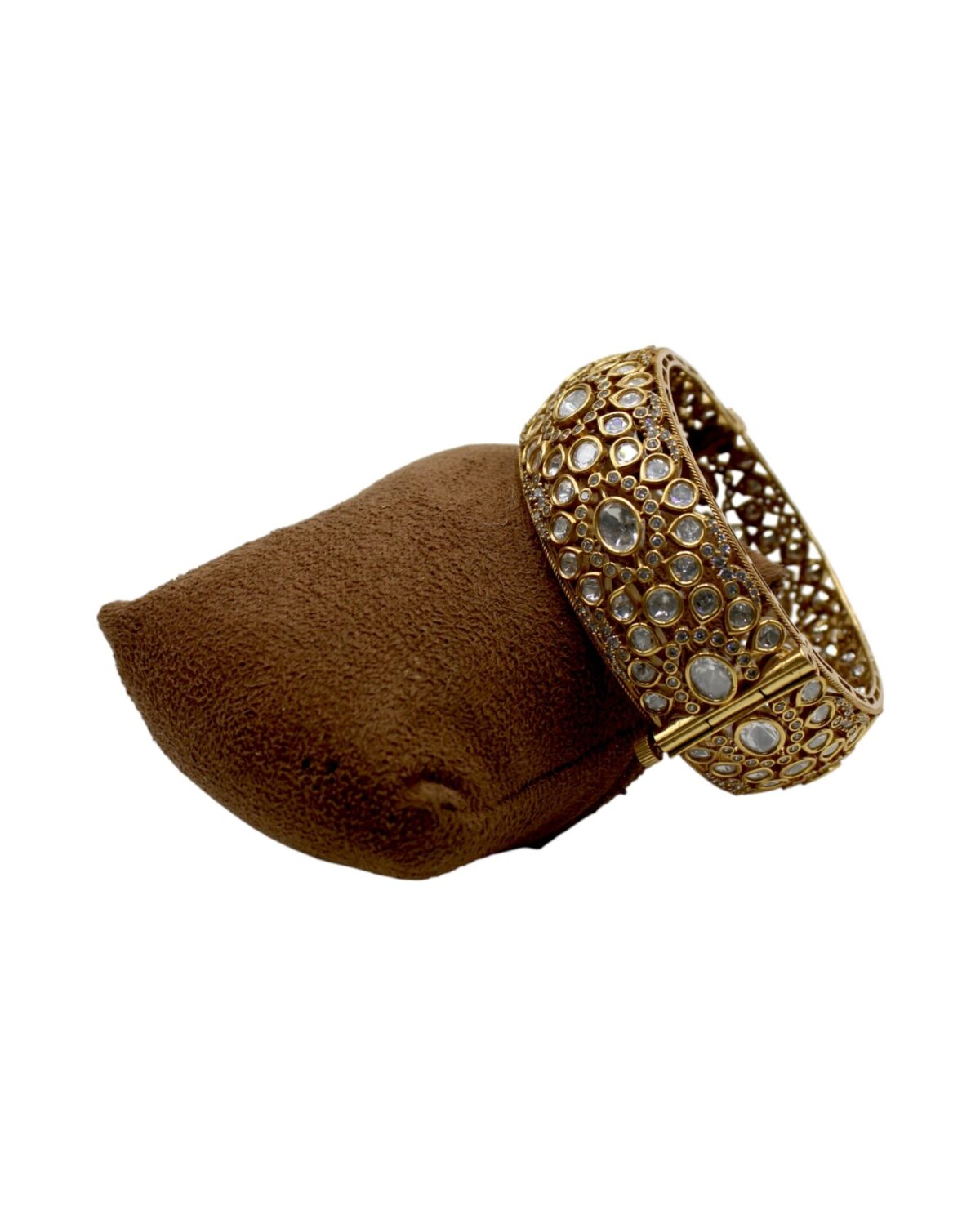 Elegant Gold and Stone-Studded Bracelet on Velvet Display
