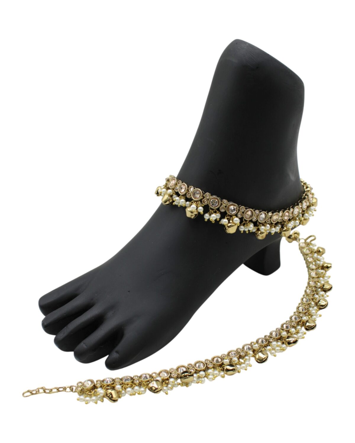 Elegant Gold Anklets Displayed on a Black Foot Model
