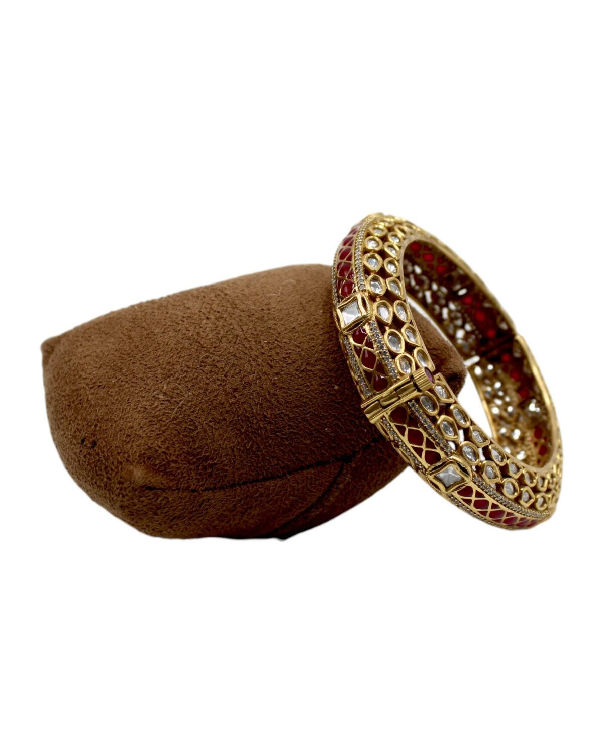 Elegant Gold and Red Stone Bangle on Velvet Display