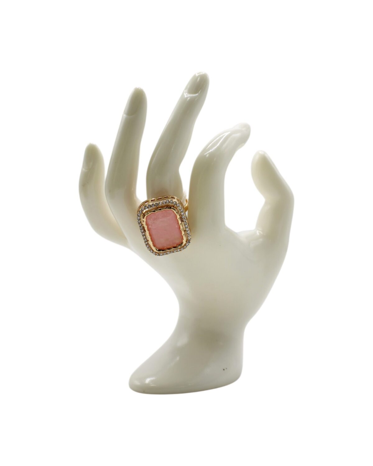 Elegant Coral Ring Displayed on a Porcelain Hand