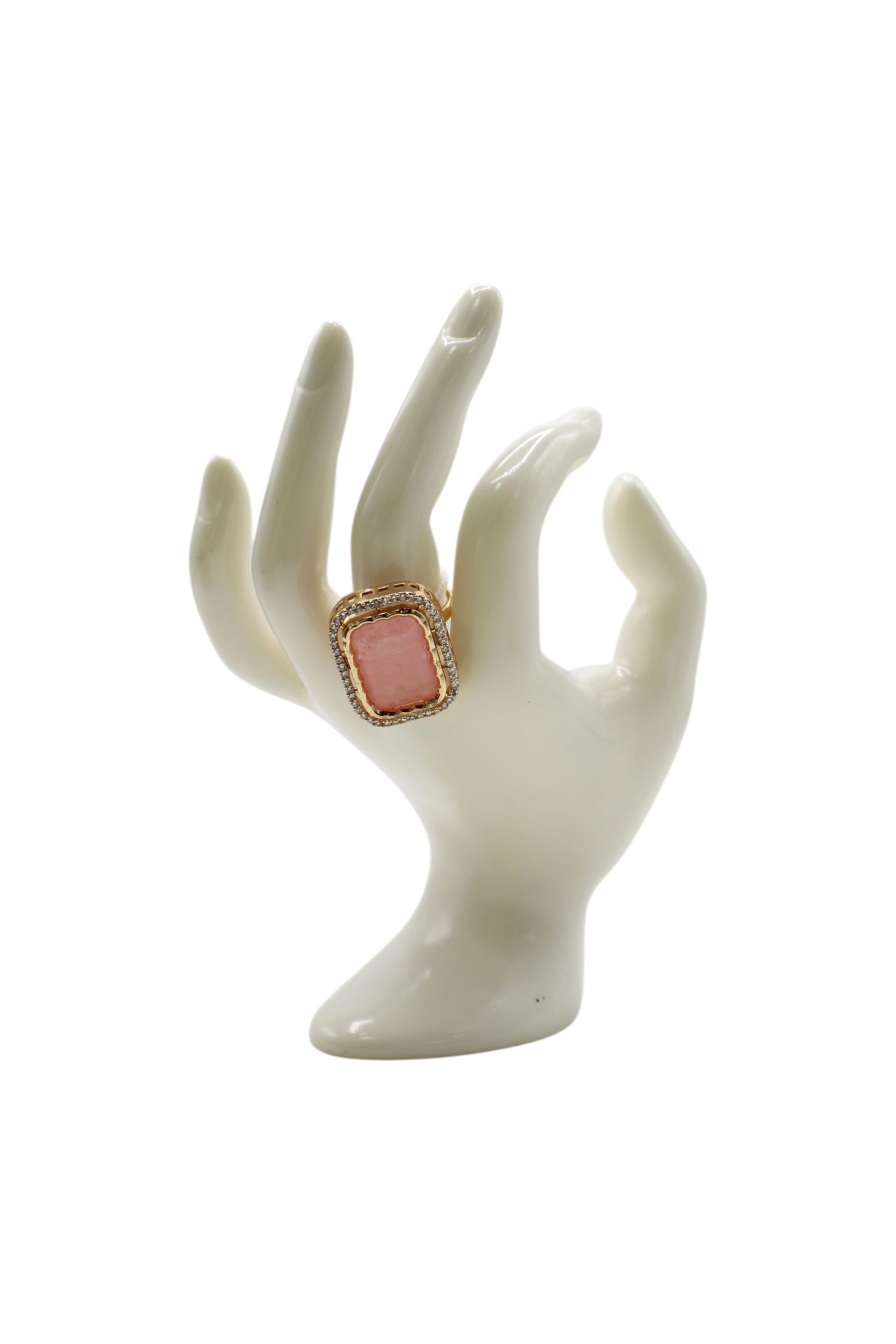 Elegant Coral Ring Displayed on a Porcelain Hand