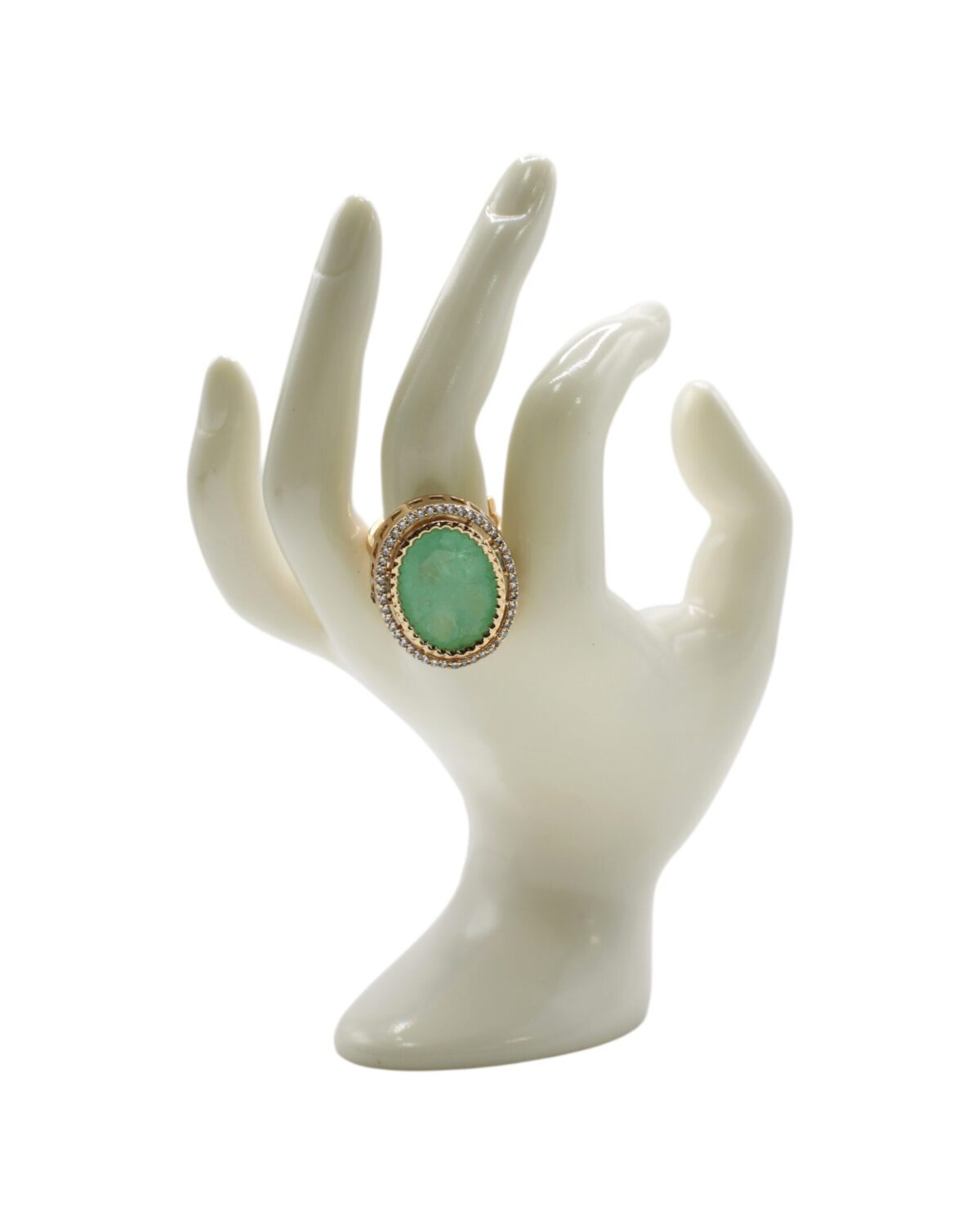 Elegant Green Stone Ring Displayed on a Decorative Hand