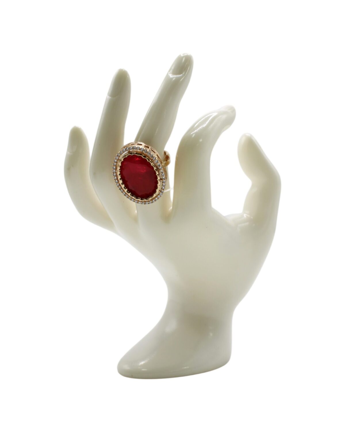 Elegant Red Gem Ring Displayed on a Porcelain Hand