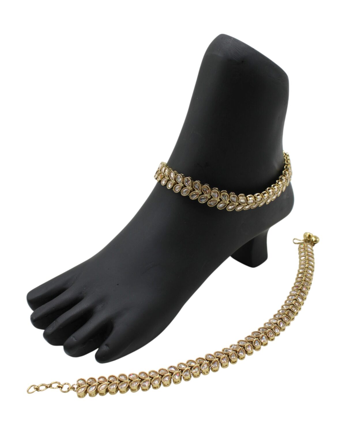 Elegant Gold Anklet Display on a Black Foot Model