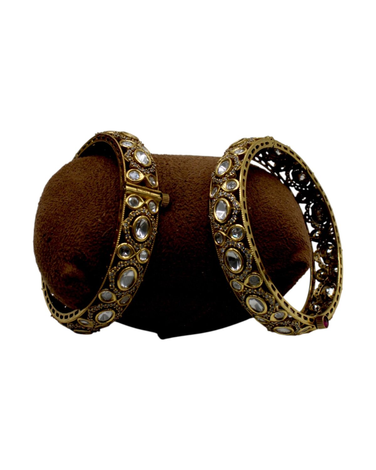 Elegant Gold Bangles with Intricate Design and Gemstone Accents