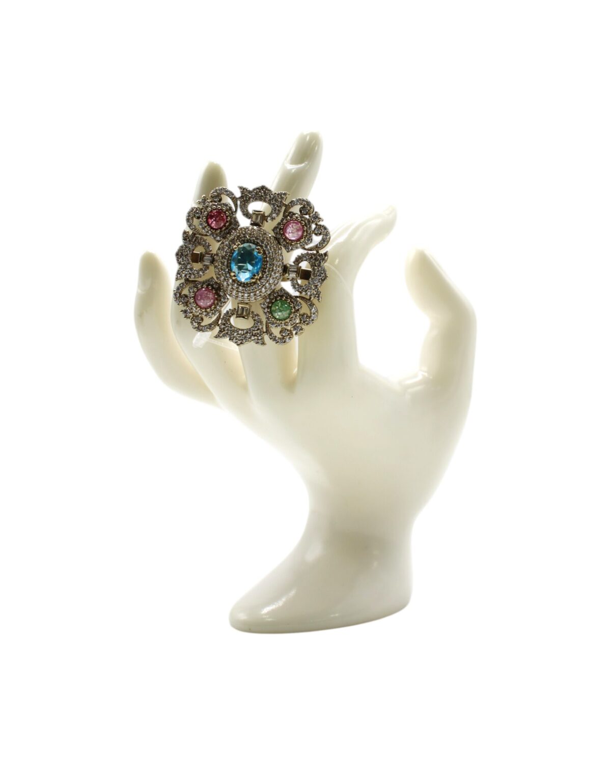 Vintage Floral Brooch Displayed on Elegant Hand Sculpture